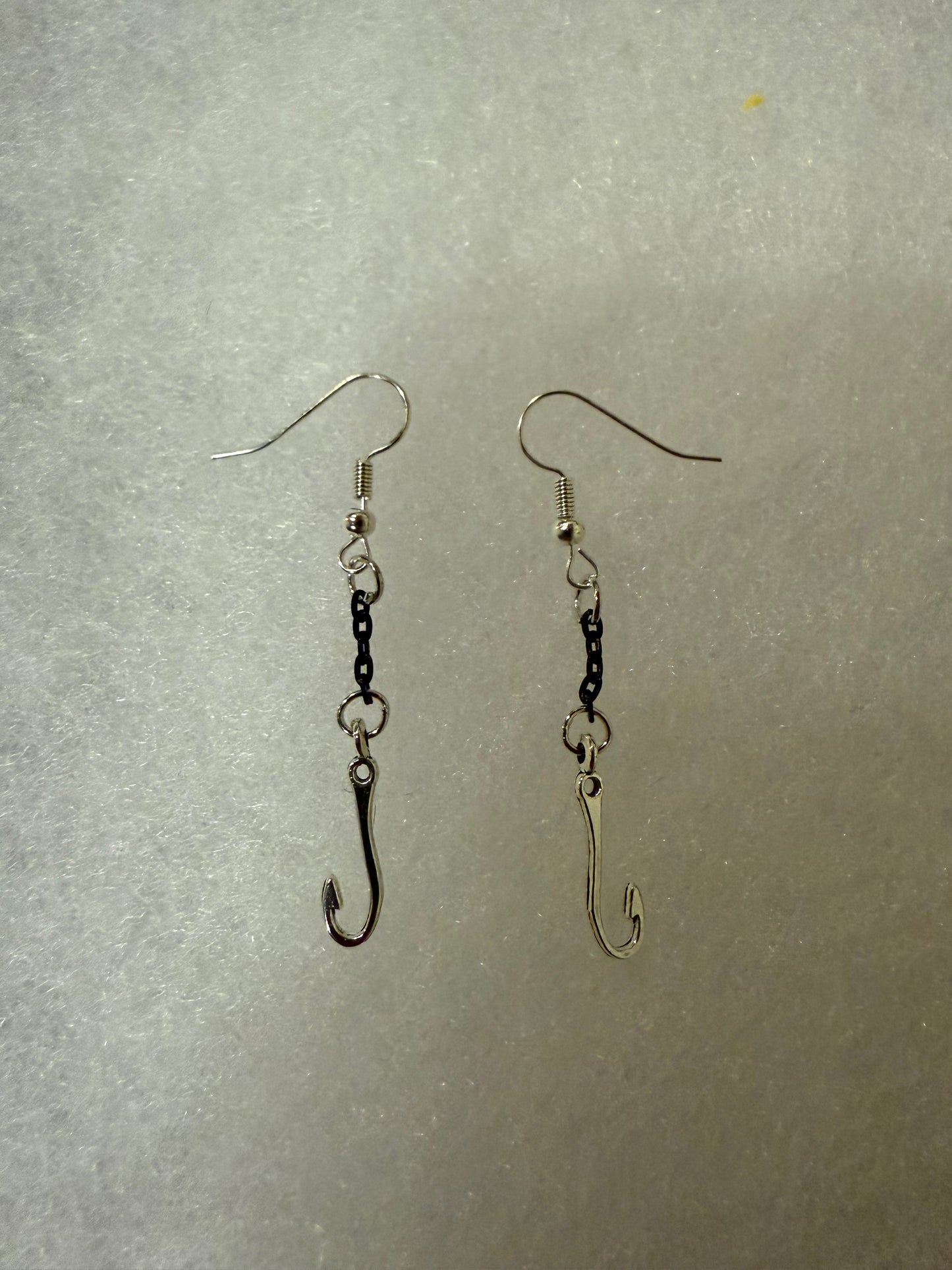 Fish hooks on black chains